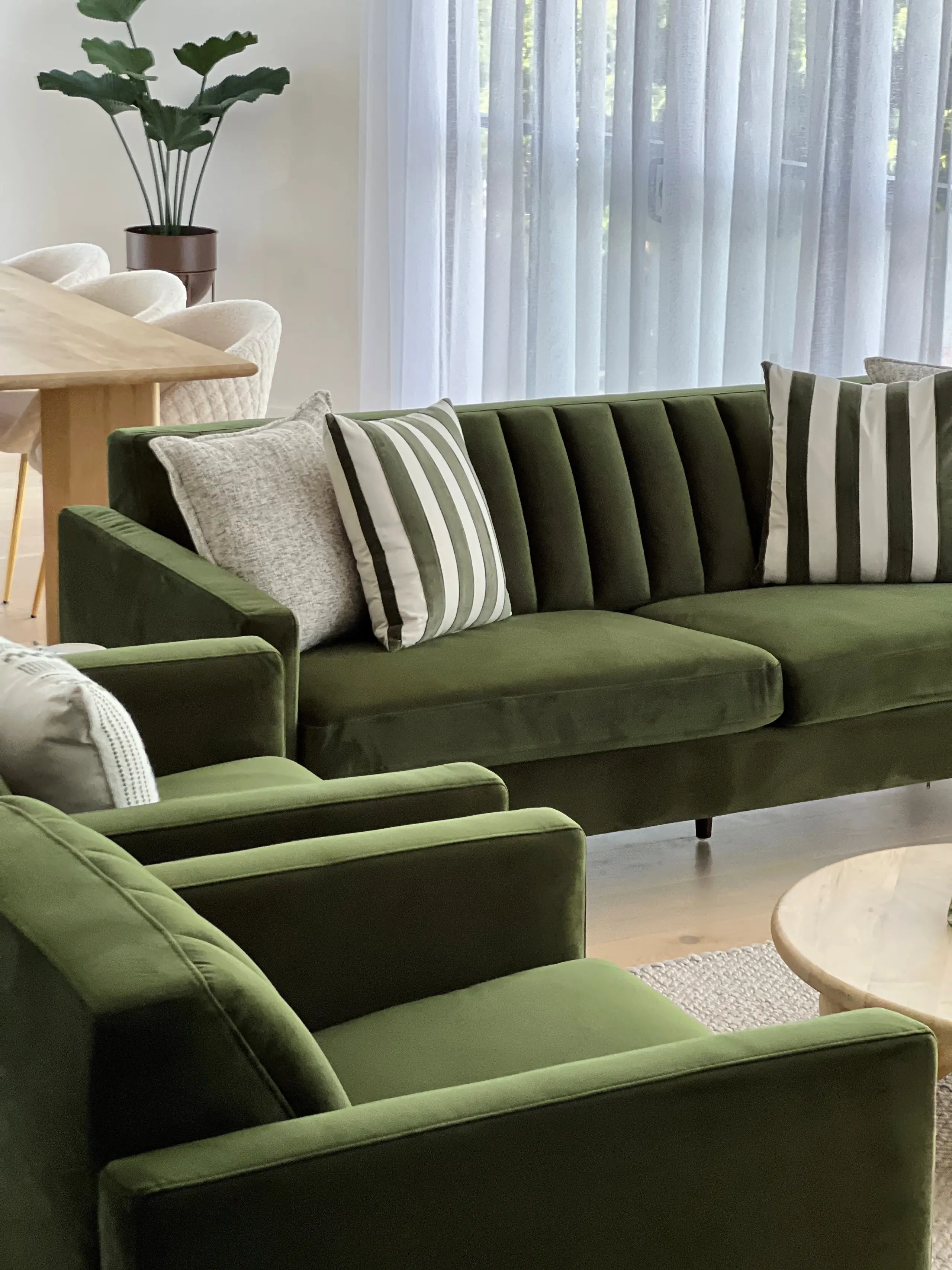 Surfers Paradise apartment living room with olive sofa and travertine coffee table