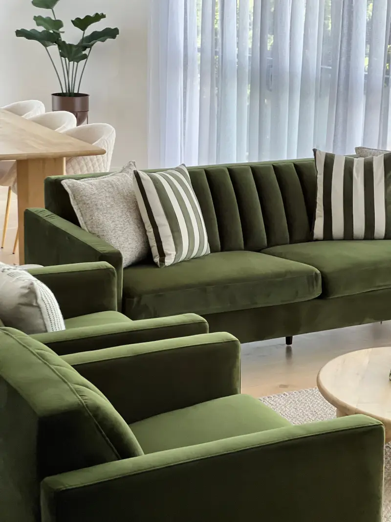 Surfers Paradise apartment living room with olive sofa and travertine coffee table